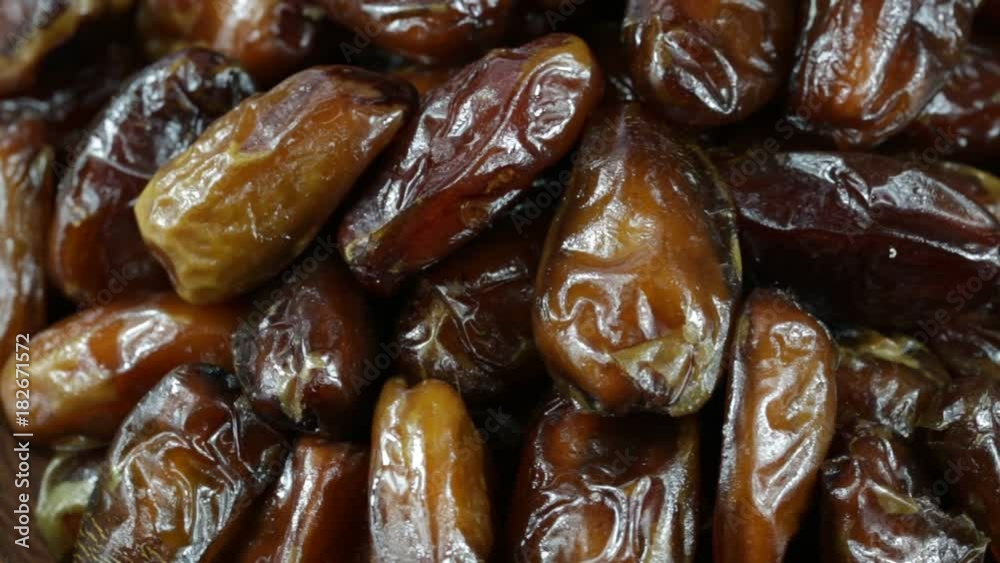 Dried date fruit rotates , close up, macro date fruit background Dried date fruit rotates , close up, macro date fruit background