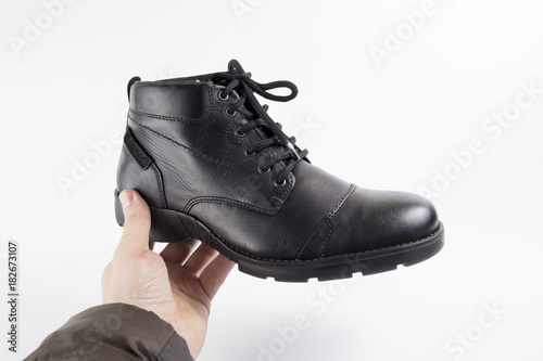 Male black leather boot on white background, isolated product, footwear.
