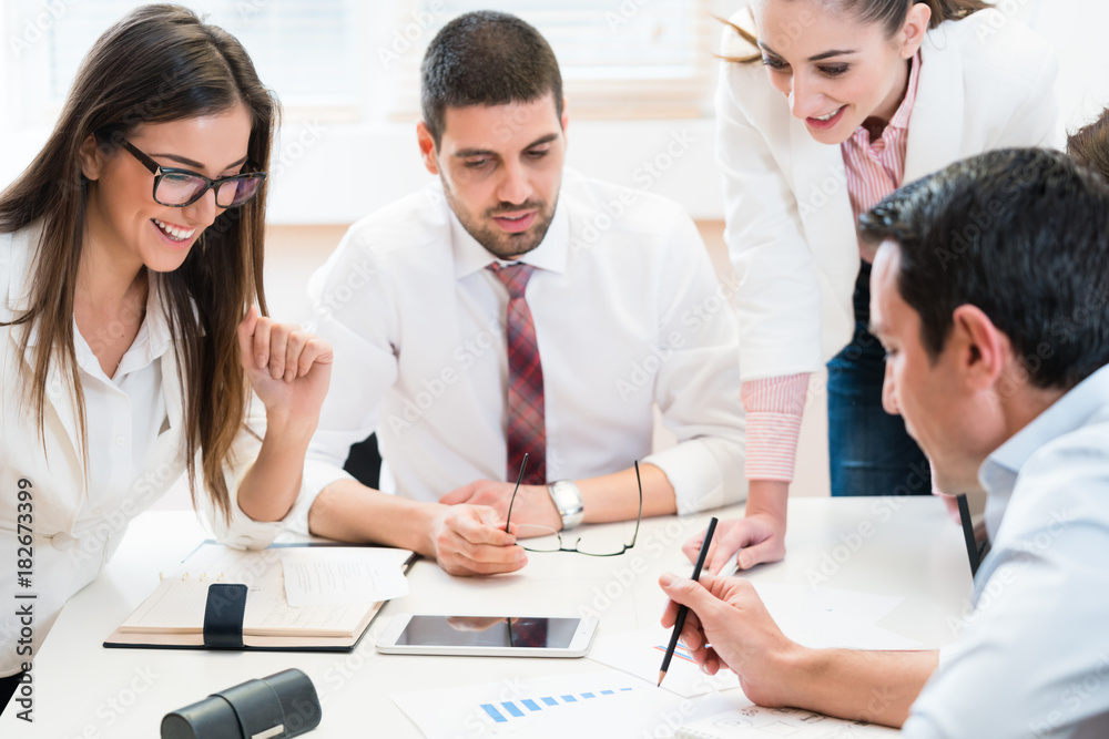 Business team analyzing data and discussing strategy in joint work Business team analyzing data and discussing strategy in joint work