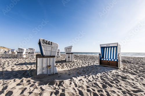 Roofed wicker beach charis at beach, Kampen, Sylt, Schleswig-Holstein, Germany photo