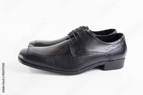 Male black leather shoe on white background, isolated product, footwear.