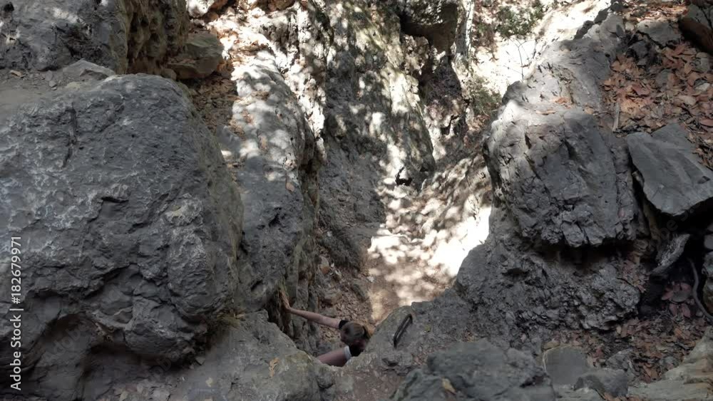 Young woman climbing in the mountain Young woman climbing in the mountain