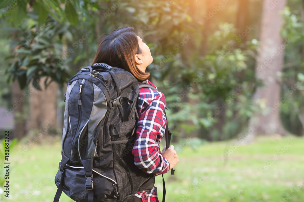 Hipster girl with backpack is enjoying the view in the wild. Hipster girl with backpack is enjoying the view in the wild.