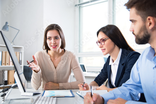 Businessman with colleagues photo