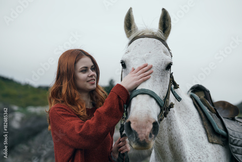 red woman, red sweater, white horse, nature, close-up
