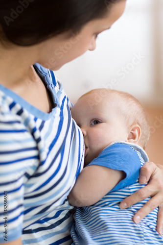 Baby feeds on mother's brea...