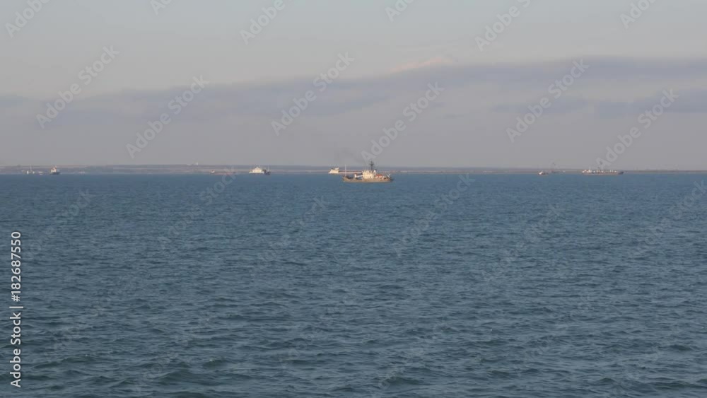 small Floating Vessel in the Kerch Strait, filming from the ship floating on a parallel course in the Black Sea, Russian water area. small Floating Vessel in the Kerch Strait, filming from the ship floating on a parallel course in the Black Sea, Russian water area.