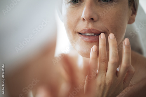 Woman Touching Her Lips photo
