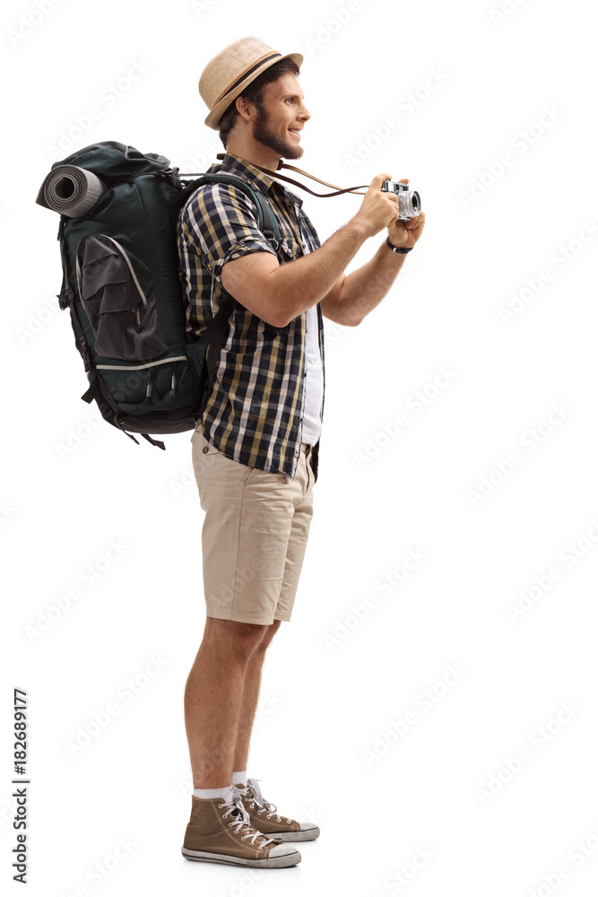 Tourist with a backpack and a camera