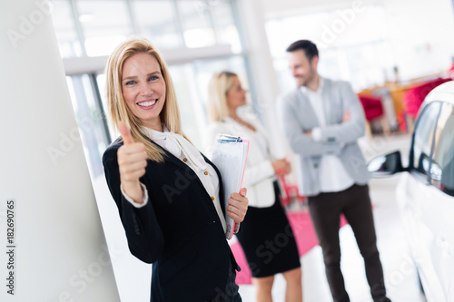 Picture of attractive saleswoman working in company