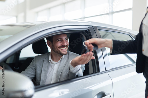 Fotografie Portrait of happy customer buying new car