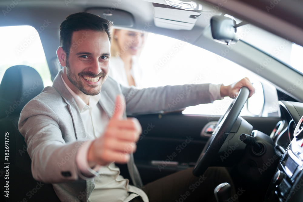 Portrait of happy customer buying new car Portrait of happy customer buying new car