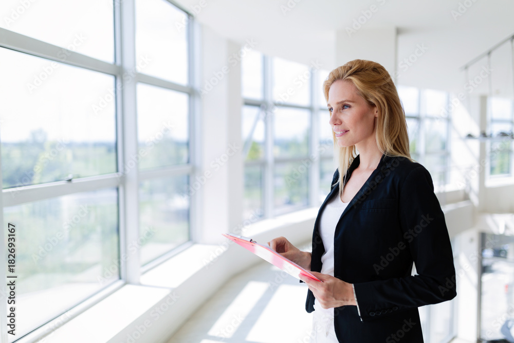 Picture of professional salesperson working in car dealership Picture of professional salesperson working in car dealership