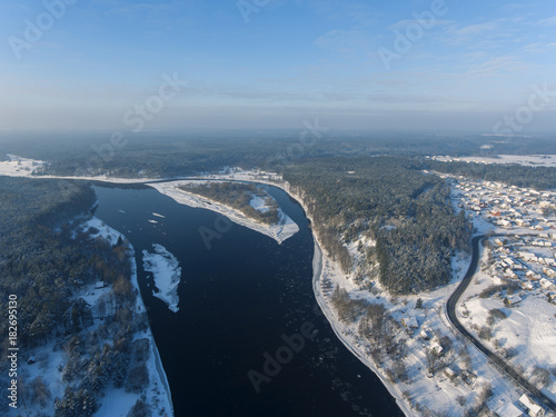 Aerial view over river Nemunas and Merkys connection in small town Merkine, Lithuania. Aerial photography during winter season. photo