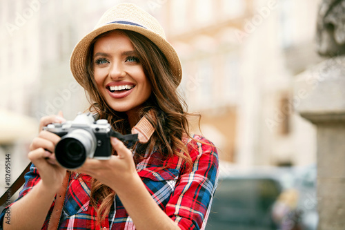 Tourist Woman With Camera Taking Photos Of Beautiful Location