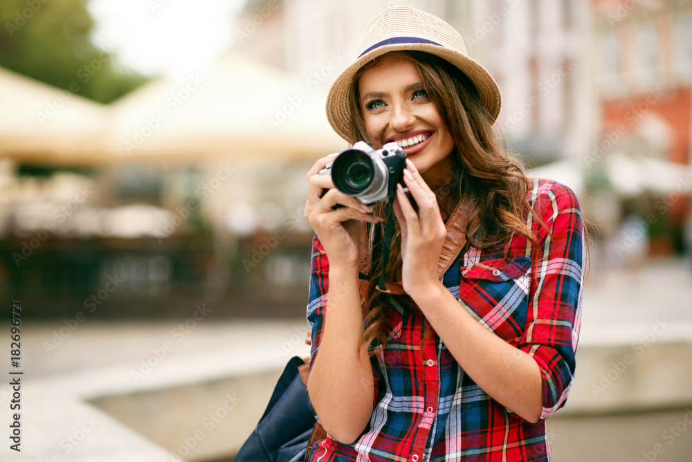 Beautiful Tourist Girl With Camera In Hands.