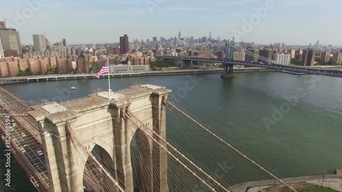 Aerial shot of Brooklyn Bridge, New York City. The camera is moving above Brooklyn bridge in the air approaching to Chinatown and upper Manhattan. 4K, Ultra HD video