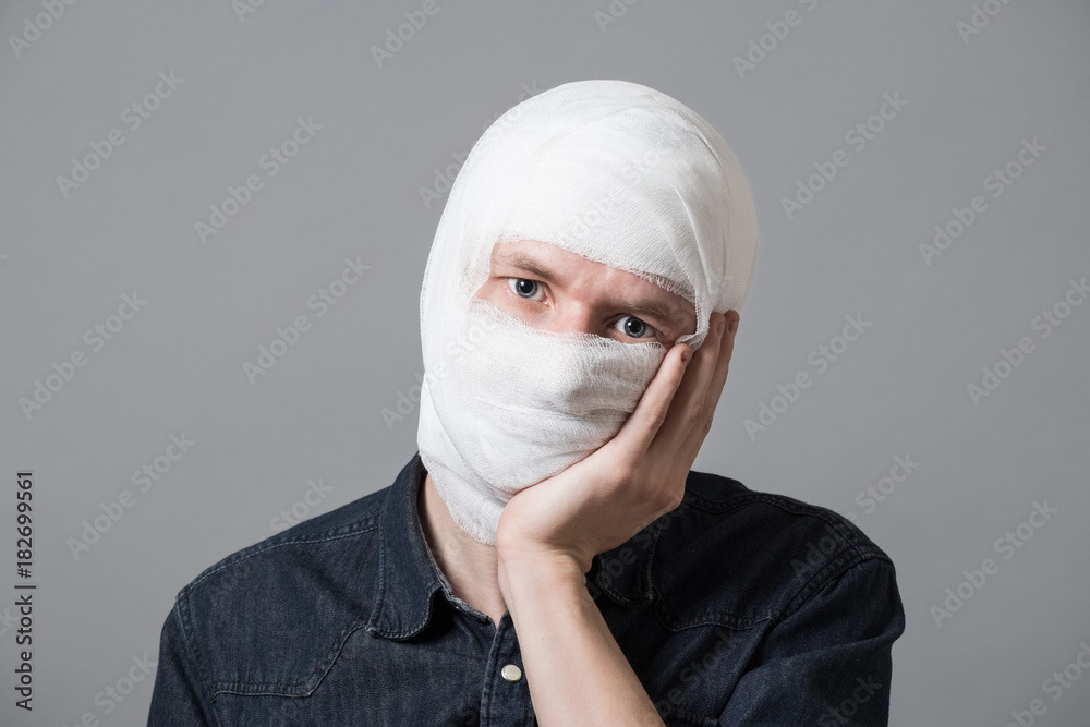 Man with bandage on his head