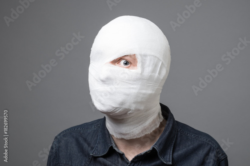 Man with bandage on his head photo