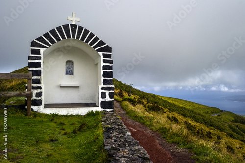 stone chapel on top of a volcano on the island of faia on the azores