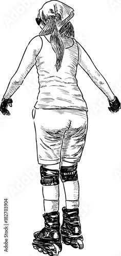 Young woman rides on the roller skates