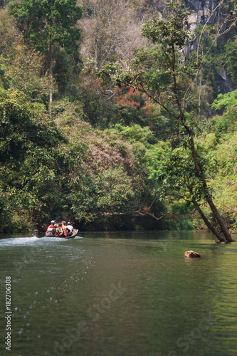 Boat trip on a river in Laos near the mountains