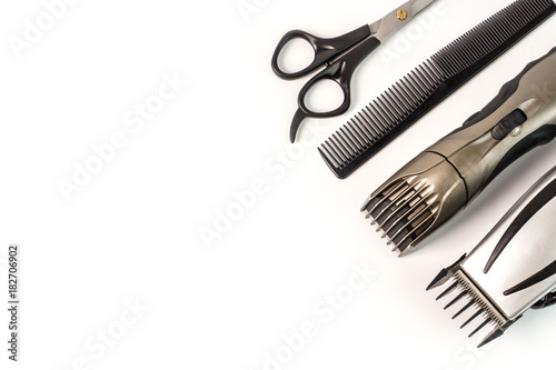 The machine for a hairstyle and hair trimmer. Hair clippers and hair trimmer with comb and scissors isolated on white background.