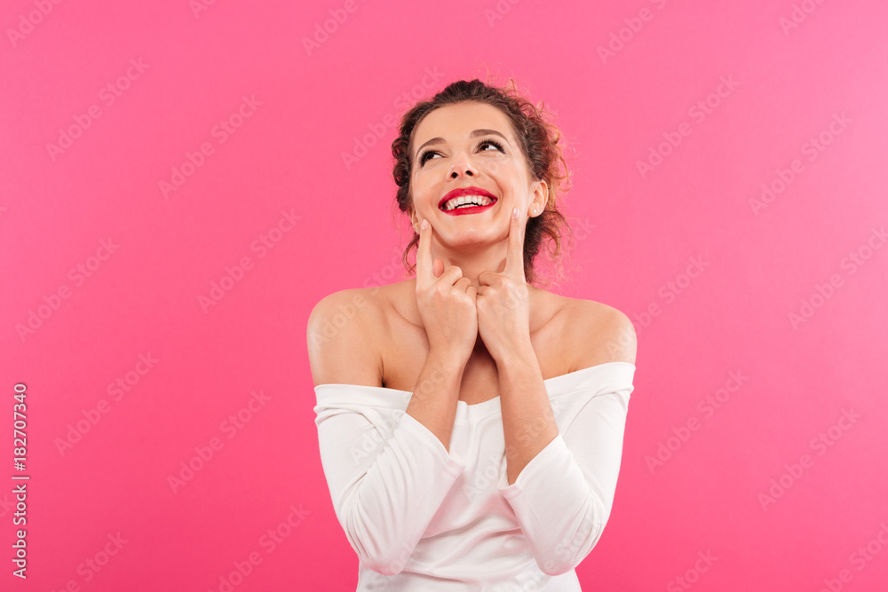 Portrait of a joyful girl celebrating success and laughing is Portrait of a joyful girl celebrating success and laughing is