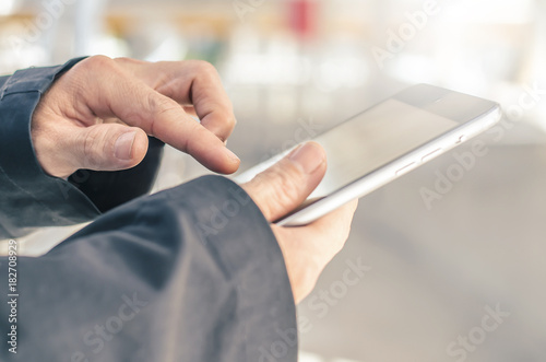 businessman hold tablet, technology, internet and networking concept - Close up image of business man holding a digital tablet planning business digital strategy achievement