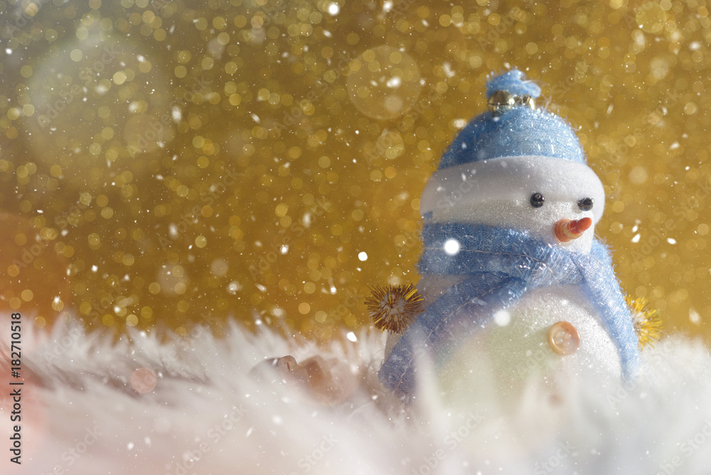 Happy snowman standing in gold winter christmas snow background. Merry christmas and happy new year greeting card with copy-space. Christmas celebration holiday background.