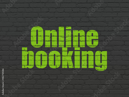 Tourism concept: Painted green text Online Booking on Black Brick wall background