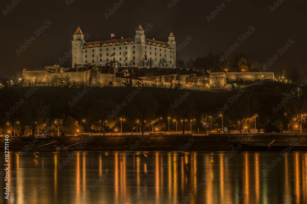 Naklejka premium Bratislava in autumn night near Dunaj river