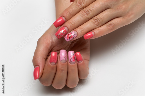 Delicate pink manicure with painted flowers and golden cobweb on long square nails 