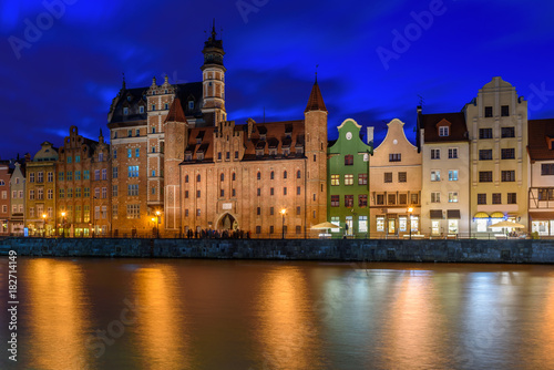 View of Gdansk's old Town and Brama Mariacka (Maria's Gate) from the Motlawa River at night. Poland, Europe. © vivoo