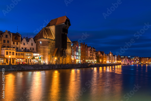 Famous old port crane of Gdansk and Motlawa river at night. Poland, Europe.