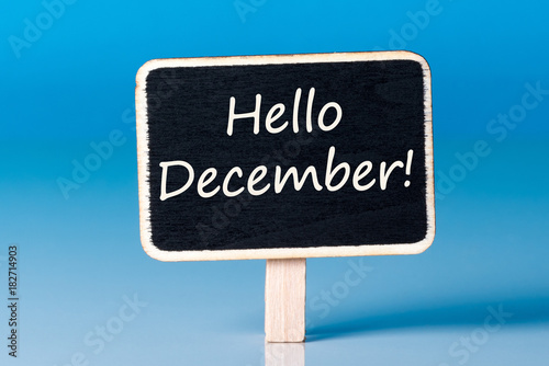 Hello december on sign at blue background. December 1st  the beginning of the Christmas and New Year holidays and sales