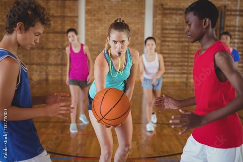 High school kids about to start playing basketball