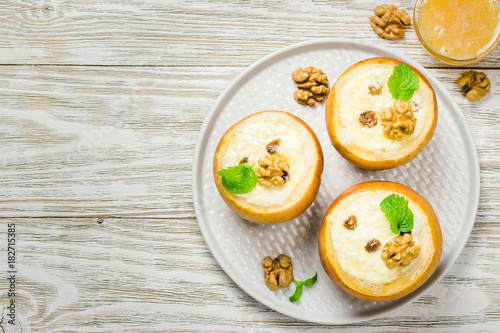 Vegetarian gluten free stuffed baked apples with raisins and honey. Top view, space for text.