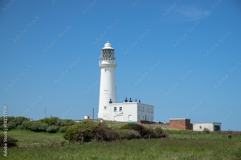 Flamborough, Yorkshire, UK. View of the modern lighthouse on top of the chalk cliffs at Flamborough Head.