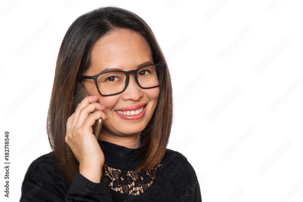 Middle adult Asian woman wearing eyeglasses using smart phone. Smiling and looking camera. Portrait on white isolate background. Middle adult Asian woman wearing eyeglasses using smart phone. Smiling and looking camera. Portrait on white isolate background.