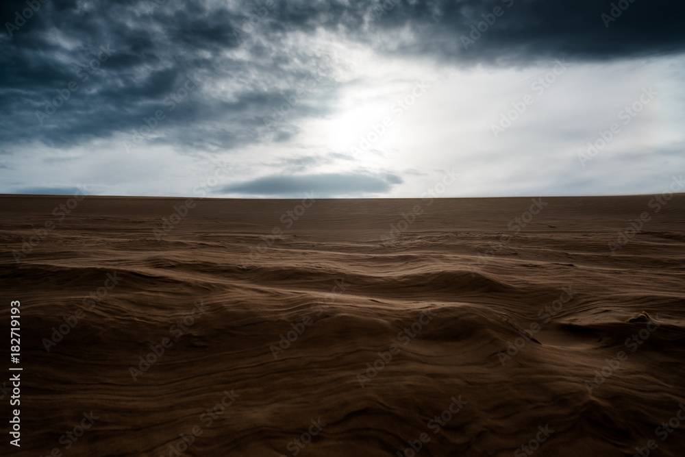 sandy dunes with dark cloudy sky. Landscape of vietnam sandy dunes with dark cloudy sky. Landscape of vietnam