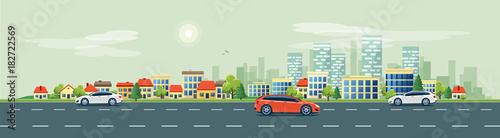 Flat vector cartoon style illustration of urban landscape road with cars, skyline city office buildings and family houses in small town village in backround. Traffic on the street. © petovarga