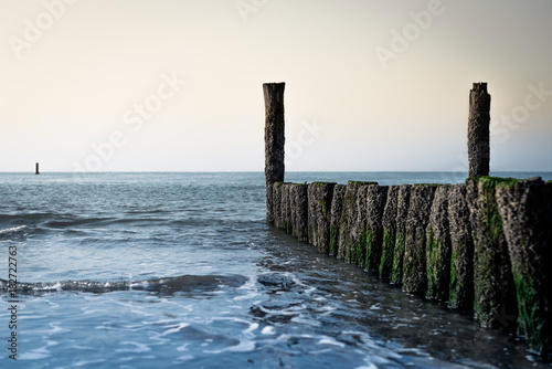 View on the sea at daytime  with breakwater. Dreamy look creating a calm  spiritual mood