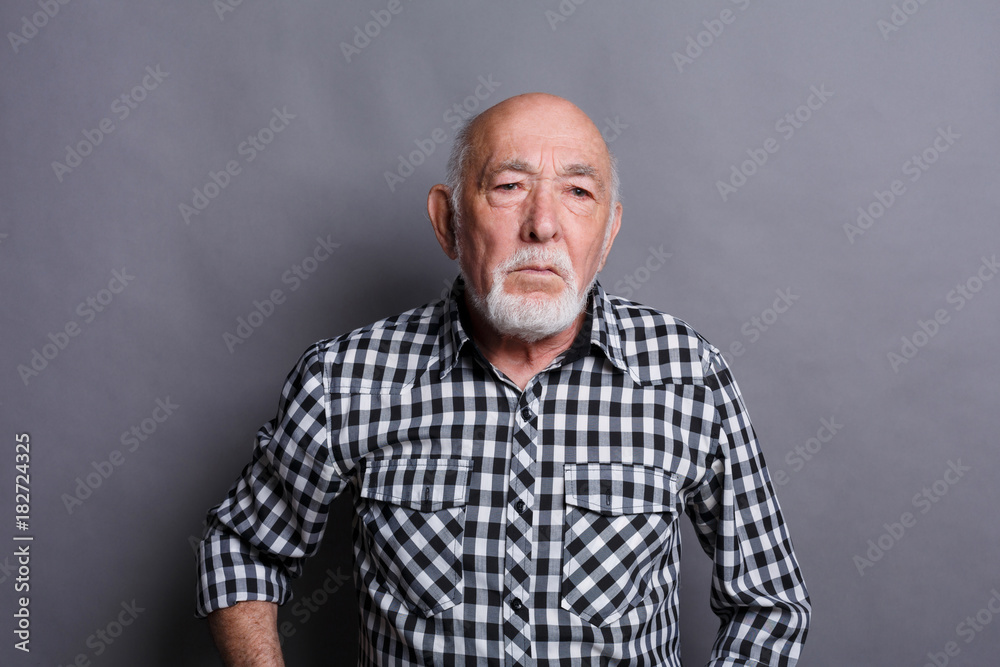 Mature man expressing disgust, grimacing Mature man expressing disgust, grimacing