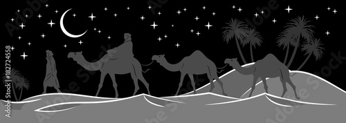 Caravan walking in the night desert