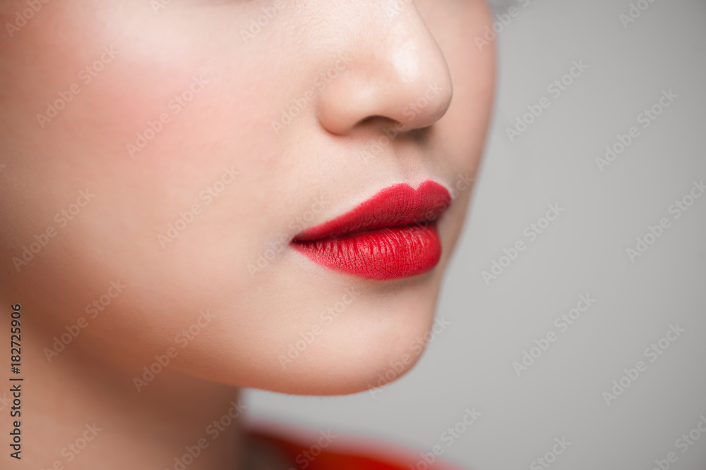 Close-up of beautiful perfect red lips. Selective focus.