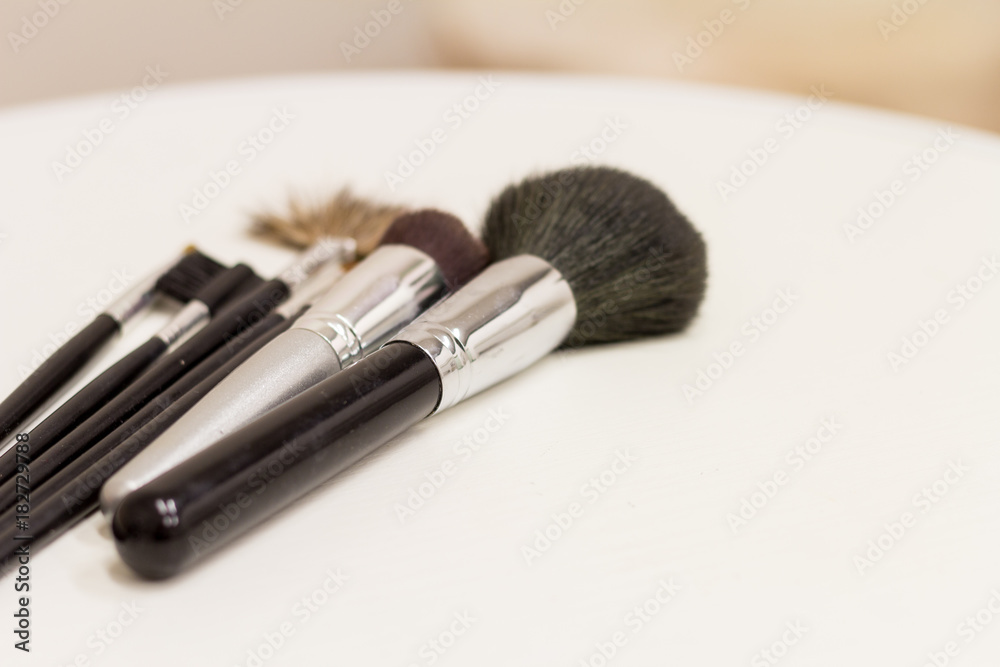 Make-up brushes on a white table close up Make-up brushes on a white table close up