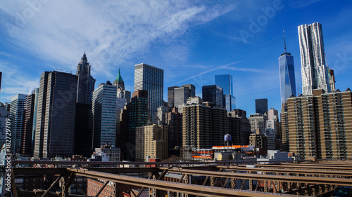 Skyline of Manhattan in New York City from Brooklyn Bridge in the afternoon