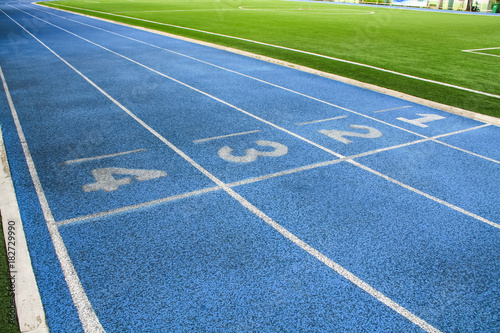 All-weather running track, rubberized artificial running surface for track and field athletics.
