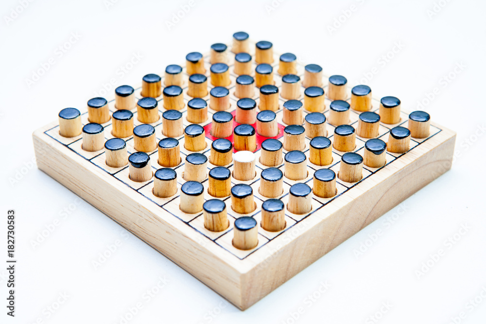 the one white in black of Wooden Revessi Othello game close up of Different wood stick on white background with a clipping path,Business concept, Selective focus the one white in black of Wooden Revessi Othello game close up of Different wood stick on white background with a clipping path,Business concept, Selective focus